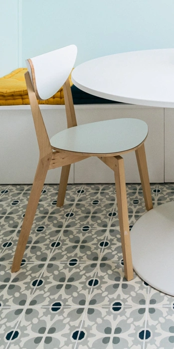 Cement tile floor in pastel colours and  turquoise and white colours